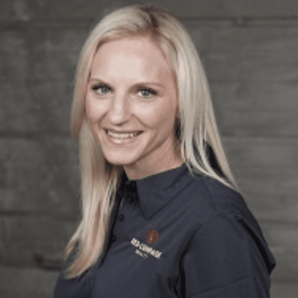 Harmon wearing black polo